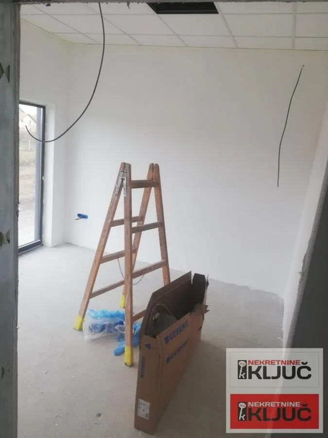 Empty room during construction work with a wooden ladder.