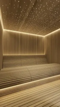 Moderna sauna obložena drvetom sa ambijentalnim osvjetljenjem na plafonu. - image 10