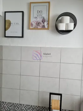Detail of wall tiles and decorative frames in the bathroom. - image 18