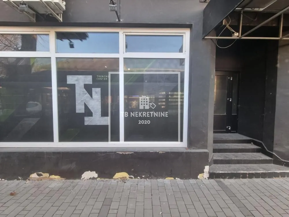 Exterior of the commercial space with entrance and display window.