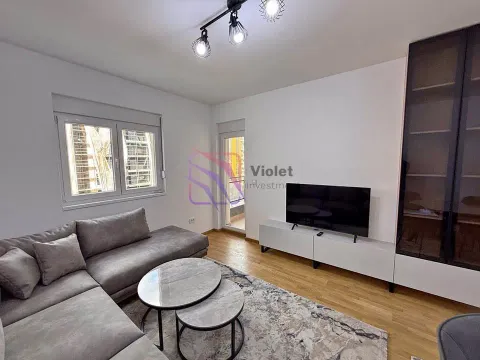 Living room with a corner sofa, television and access to the terrace. - image 3