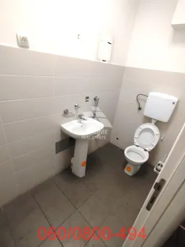 Smaller bathroom with a sink and a toilet. - image 8