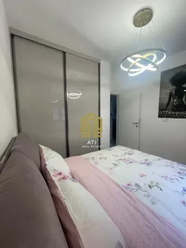 Furnished bedroom with a large double bed and built-in wardrobe. - image 14
