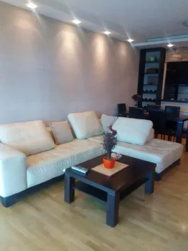 Living room with a light corner sofa and a coffee table. - image 3