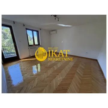 Empty room with hardwood parquet flooring and access to the terrace. - image 5