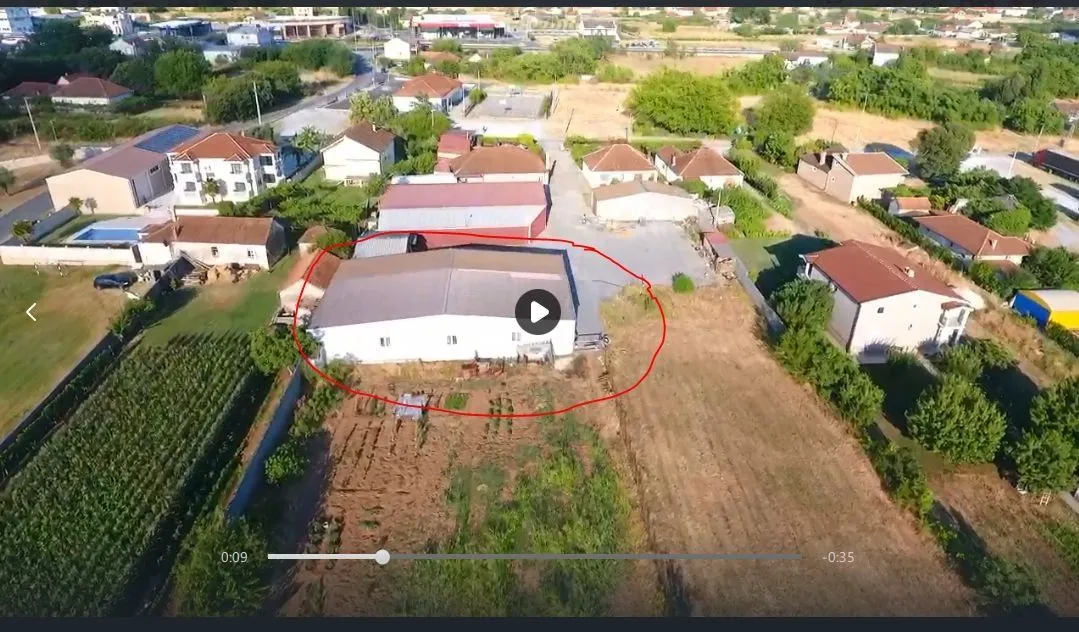 Aerial view of the building and the surrounding land.