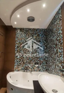 Bathroom with corner bathtub, washbasin, and mosaic tiles. - image 11