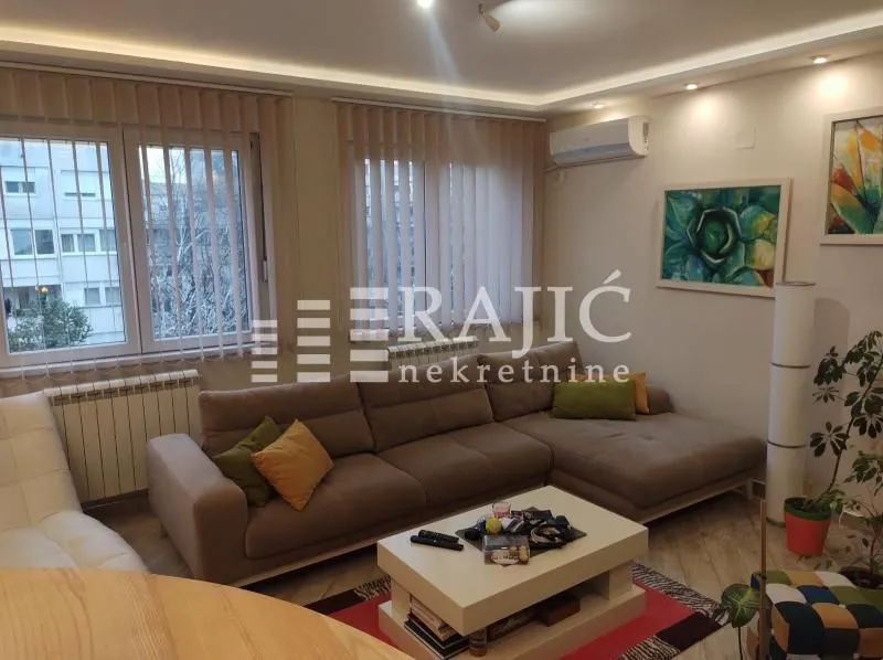 Comfortable living room with sofa and coffee table.