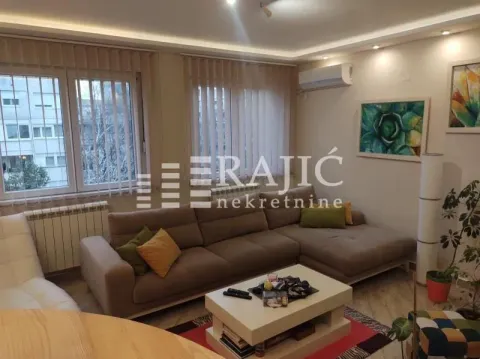 Comfortable living room with sofa and coffee table. - image 3