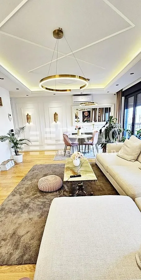 Modern and bright living room with a dining area and sofa.