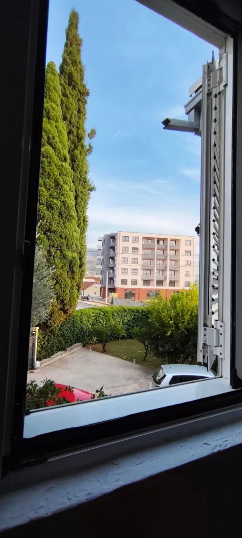 View through the window of the courtyard and surrounding buildings.