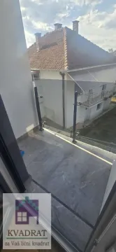 View from the balcony overlooking surrounding houses. - image 6