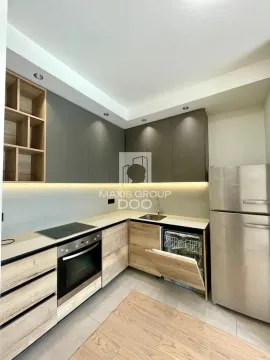 Modern kitchen with built-in units and refrigerator. - image 4