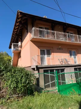 Exterior view of the house with a yard and terraces. - image 4