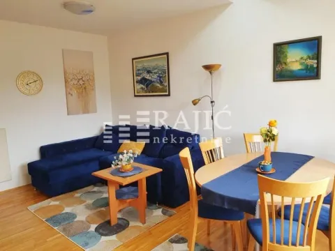 Living room with a dining area and a blue corner sofa. - image 5