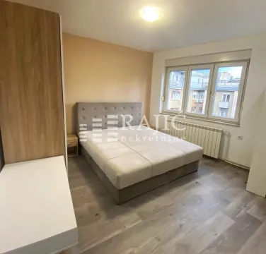 Furnished bedroom with a double bed and wardrobe. - image 5