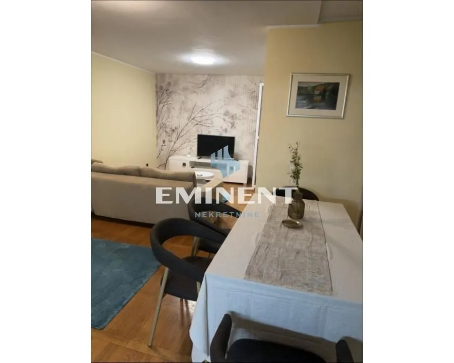 Living room with a dining area and seating set.