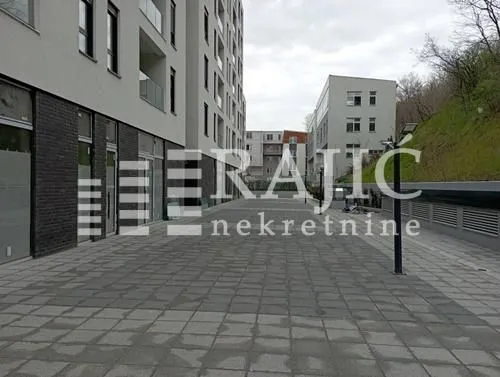 View of the paved courtyard between residential buildings.