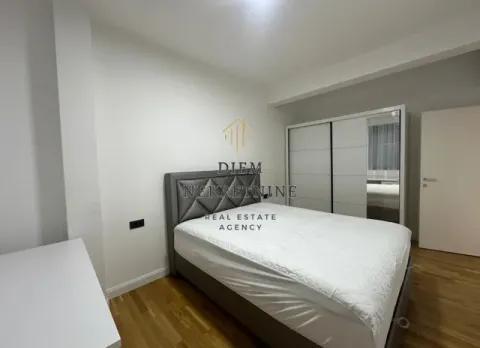 Furnished bedroom with a double bed and a fitted wardrobe. - image 9