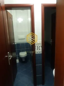 View of the bathroom through an open door. - image 4