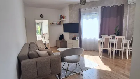 Living room with sofa, TV and dining table. - image 3
