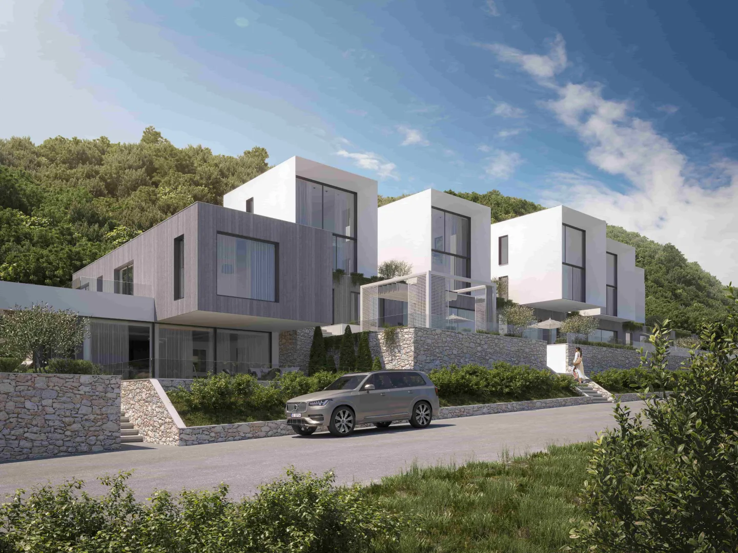 Spoljašnji izgled modernih vila sa uređenim dvorištem i parkingom.