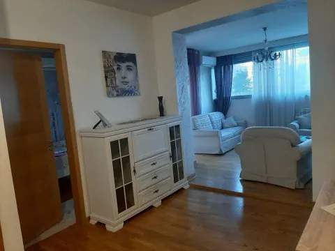 Living room featuring a seating set and a white cabinet in the foreground. - image 11