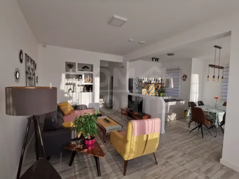 Spacious living room connected to the dining area and kitchen. - image 2