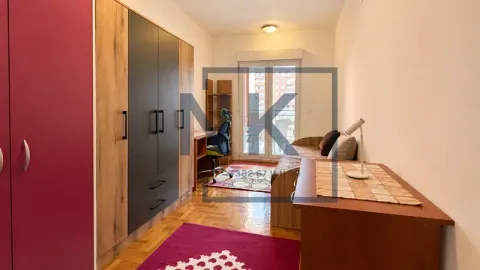 Children's bedroom with a bed, a large wardrobe, and a desk. - image 10