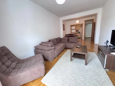 Living room with a sofa set, coffee table and view of the dining area. - image 3
