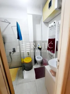 View of the bathroom with a shower cabin, sink, and toilet. - image 3