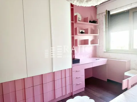 Children's bedroom with a large wardrobe, desk and shelving units. - image 8
