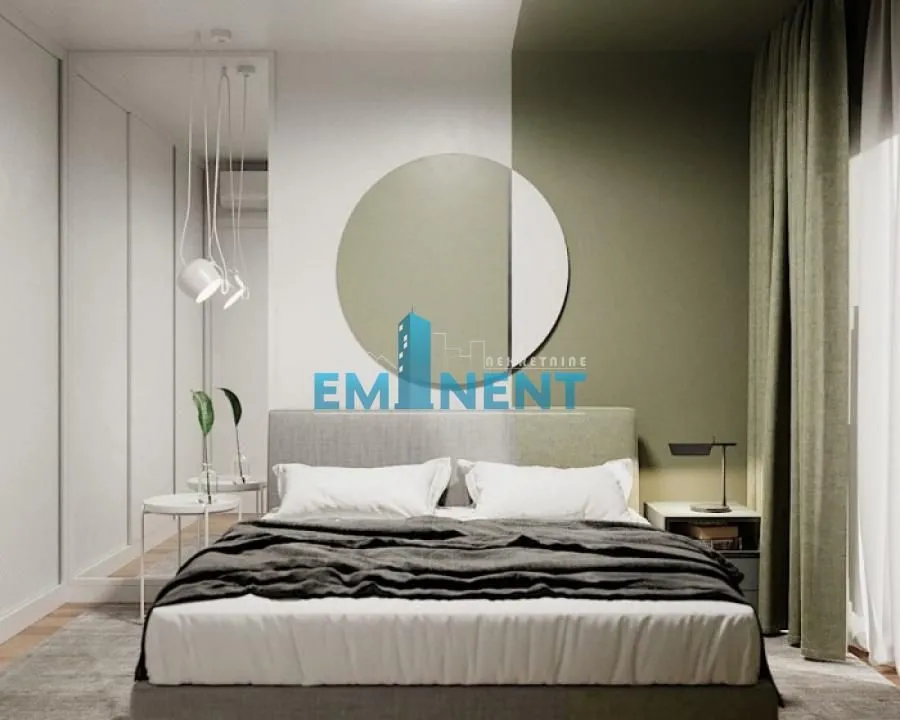 Modern bedroom with a double bed and a decorative mirror on the wall.