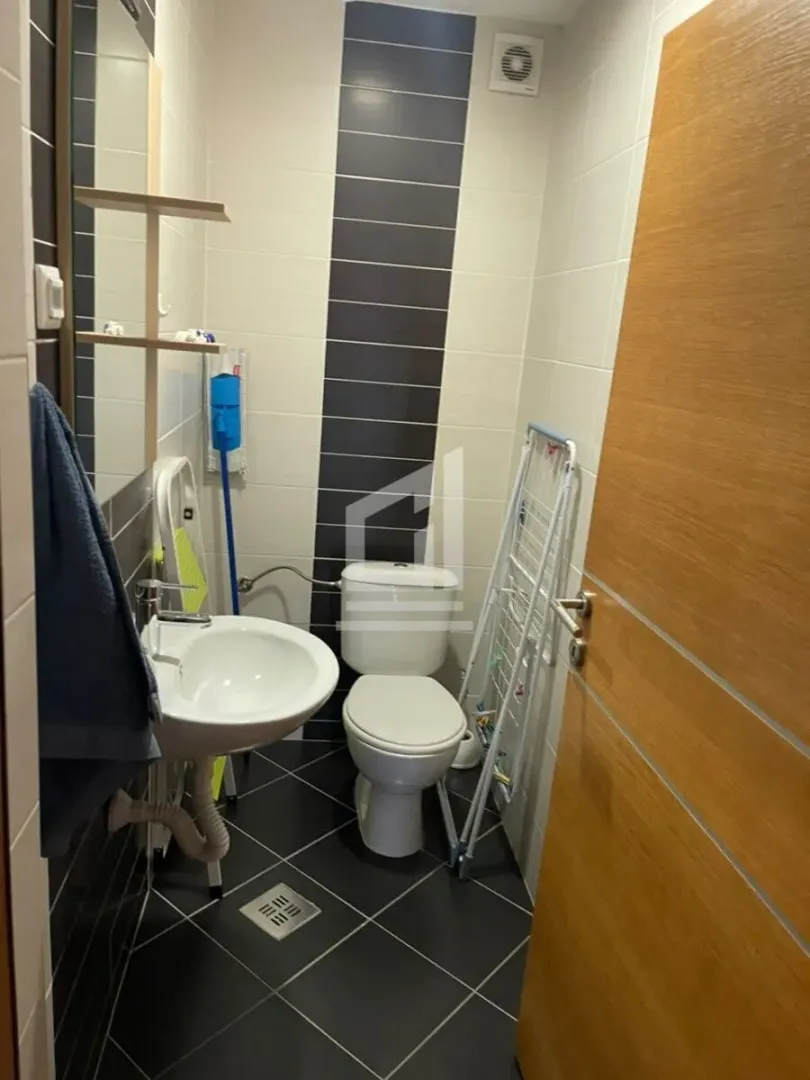 Smaller bathroom with a washbasin and toilet bowl.