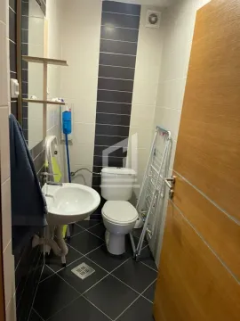 Smaller bathroom with a washbasin and toilet bowl. - image 8