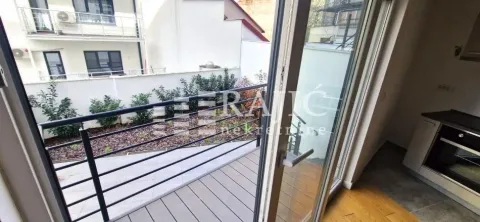 View from the terrace towards the yard and surrounding buildings. - image 16