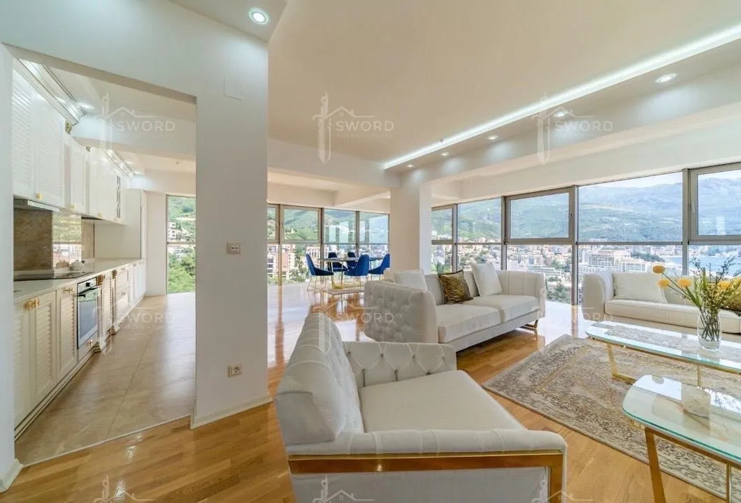 Spacious and bright living room connected to the dining area and kitchen.