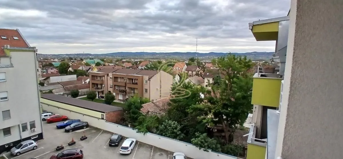 View from the terrace overlooking the surrounding neighborhood and parking lot.