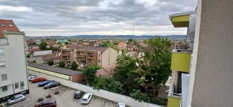 View from the terrace overlooking the surrounding neighborhood and parking lot. - image 7
