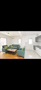 Spacious living room connected to the kitchen in bright tones. - image 10
