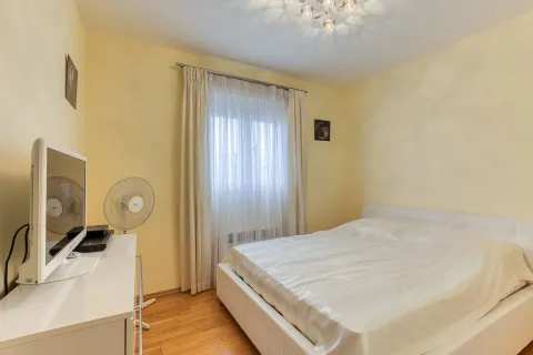 Bedroom with a double bed, dresser, and television. - image 13