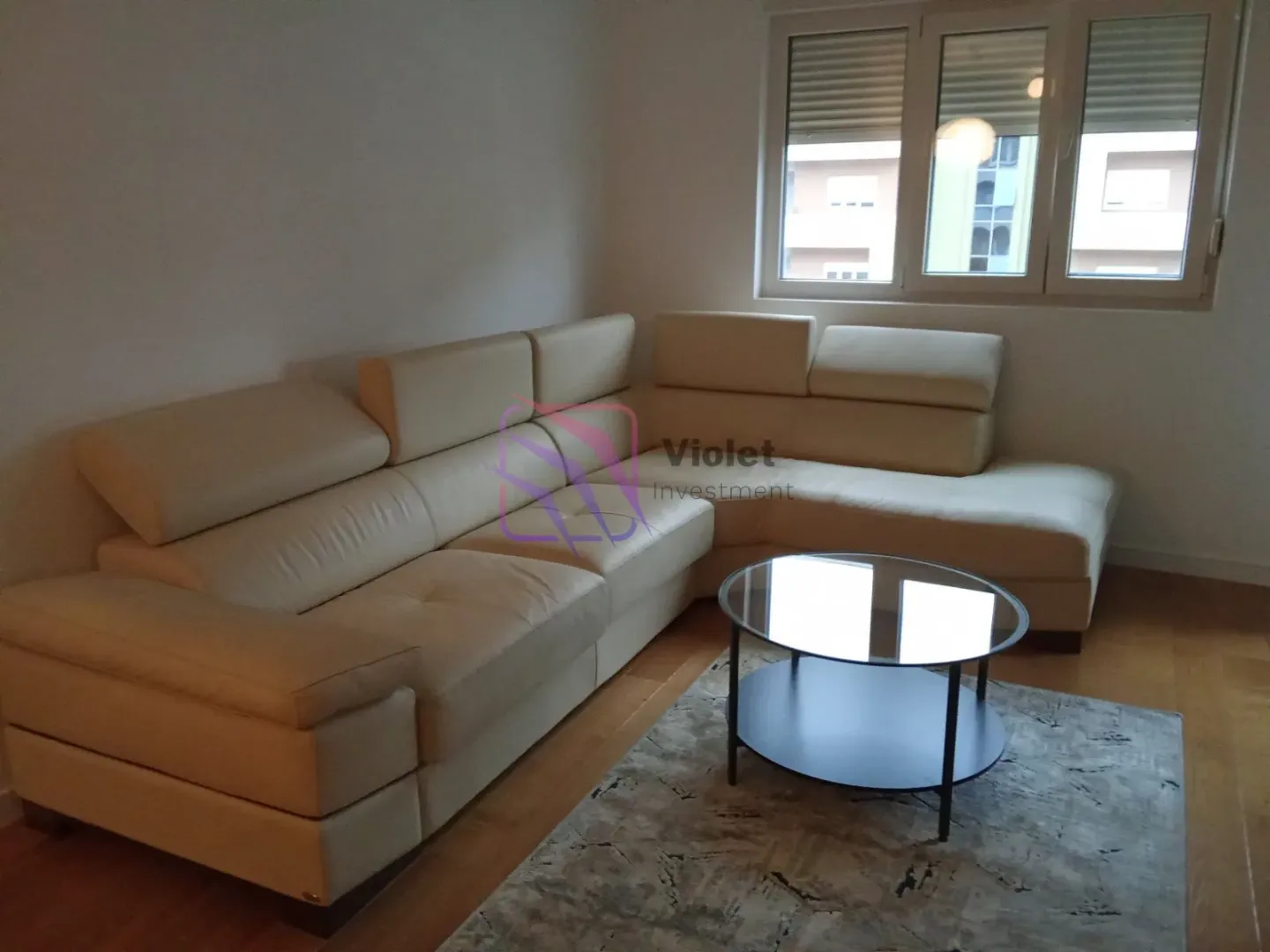 Living room with a sectional sofa and a coffee table.