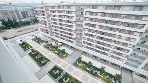 Aerial view of the residential building exterior and landscaped courtyard. - image 14