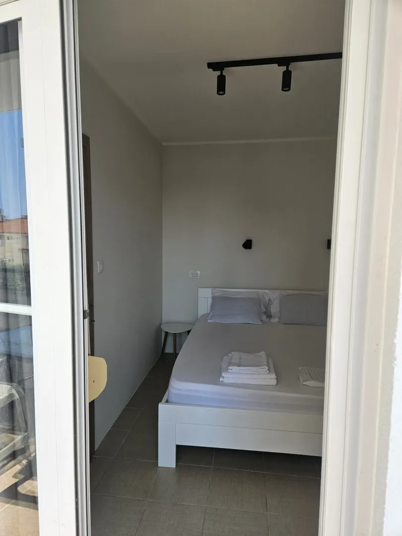 View from the doorway into the bedroom with a double bed.