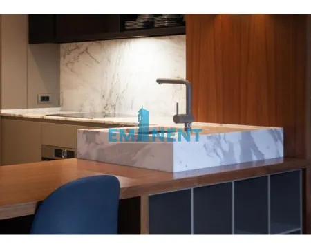 Modern kitchen with a marble countertop and a sink. - image 3