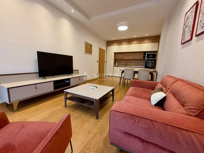Living room connected with the dining area and kitchen.