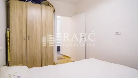 Furnished bedroom with a wardrobe and a double bed. - image 8