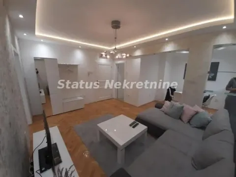 Dnevna soba sa ugaonom garniturom, stočićem i TV komodom. - image 4