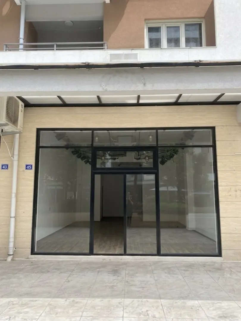 Exterior of a commercial space with a large glass shopfront.