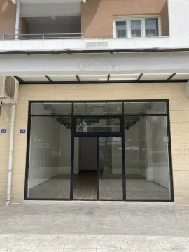Exterior of a commercial space with a large glass shopfront. - image 2